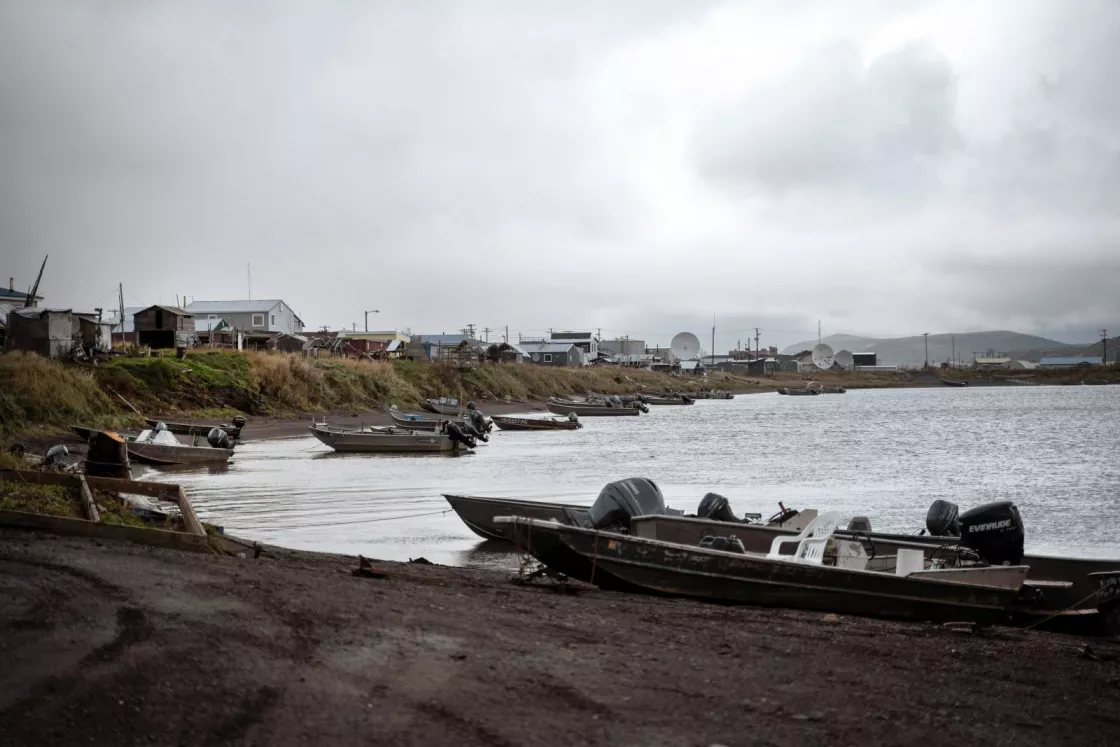 Fishing boats line the shore in Unalakleet, Alaska.