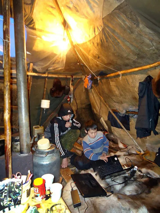 Best of the both worlds. Children using laptops in the yaranga tent of the Brigade 4, March 2014.