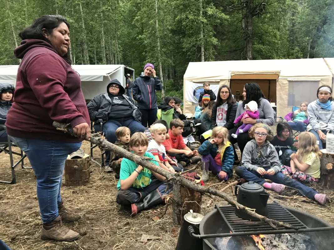Amy Juan from Tohono O'odham tells a traditional story from her community to the children at the the Nay’dini’aa Na’Kayax’ (Chickaloon Village) culture camp.