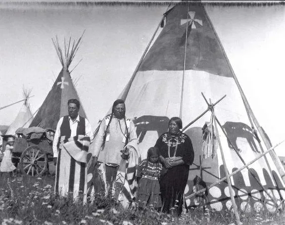 Piikani [Blackfeet] Family in front of Tipi with Bear Design, Cardston, Alberta, 1927.