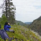 Members look out onto mountain Members look out onto mountain